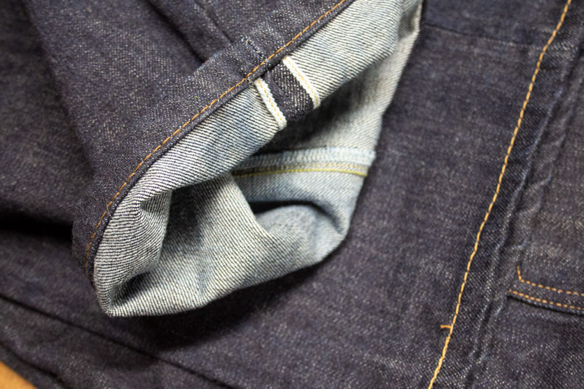 Lockstitch sewing on selvedge denim jeans hem