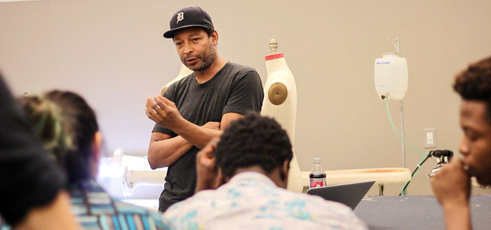 African American denim designer and fashion brands owner Maurice Malone speaking to students in denim class at Parson School of Design