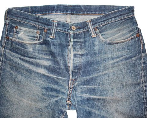 Close-up of naturally faded vintage Levi's jeans with whiskers at hips and extending from crotch
