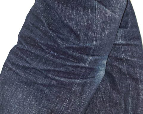 Side view of stretch marks on jeans