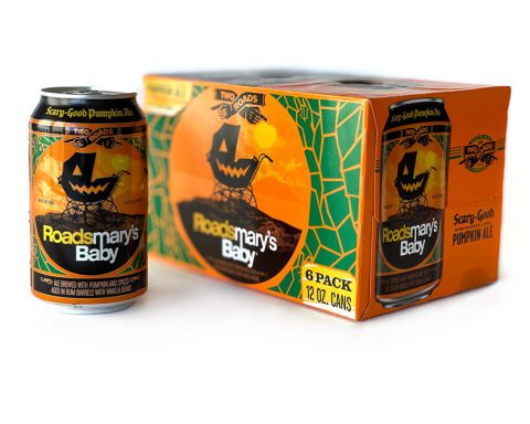 A 12-ounce can of Roadsmary's Baby pumpkin ale beer is displayed in the foreground of a 6-pack of cans box, brewed by Two Roads Brewing Company