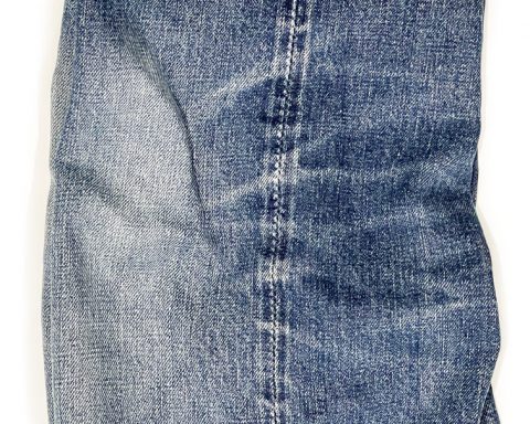 Close-up of denim train tracks on jeans outseam