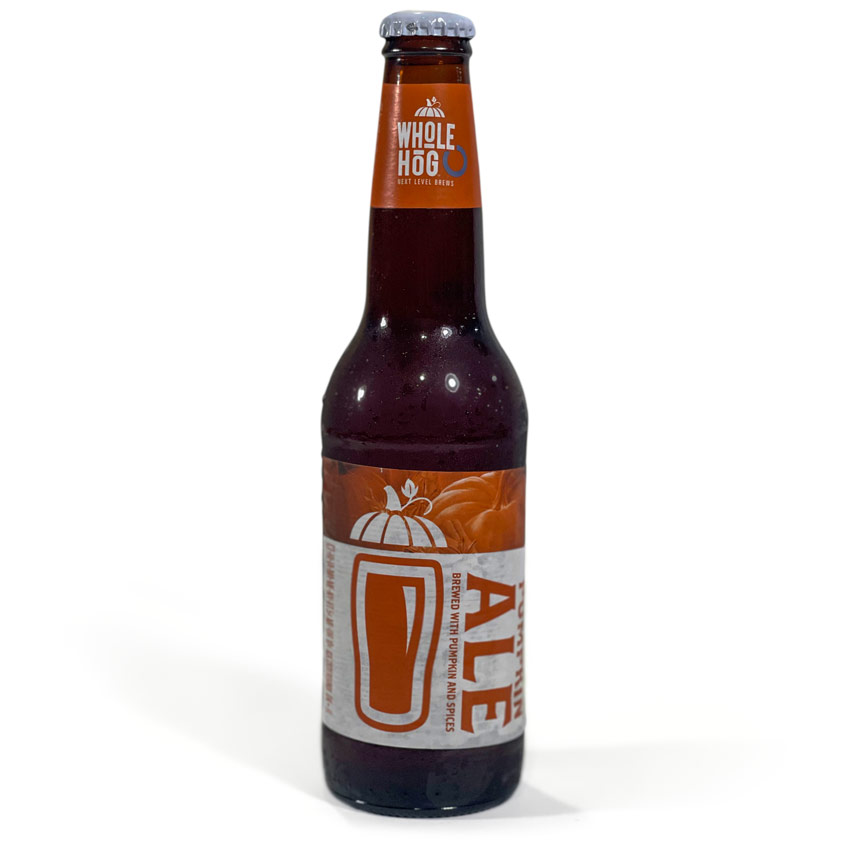 Whole Hog Brewery Pumpkin Ale, set against a white background in a 12-ounce bottle