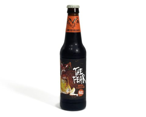 12 oz bottle of Flying Dog Brewery’s The Fear Imperial Pumpkin Ale against a white background, showcasing its vibrant label with a snarling dog illustration.