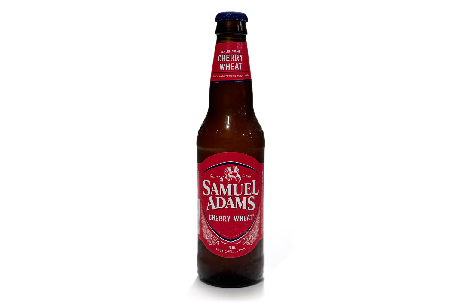 Bottle of Sam Adams Cherry Wheat beer standing on a white background for review.