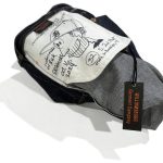 Signed handmade jeans with illustrated pocket bag and Williamsburg Garment Company tag, representing the upcoming denim workshop where attendees learn how to make jeans.