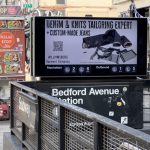 Subway billboard at Bedford Avenue Station featuring Williamsburg Garment Company’s denim tailoring and knitwear alteration ad above the L Train entrance.